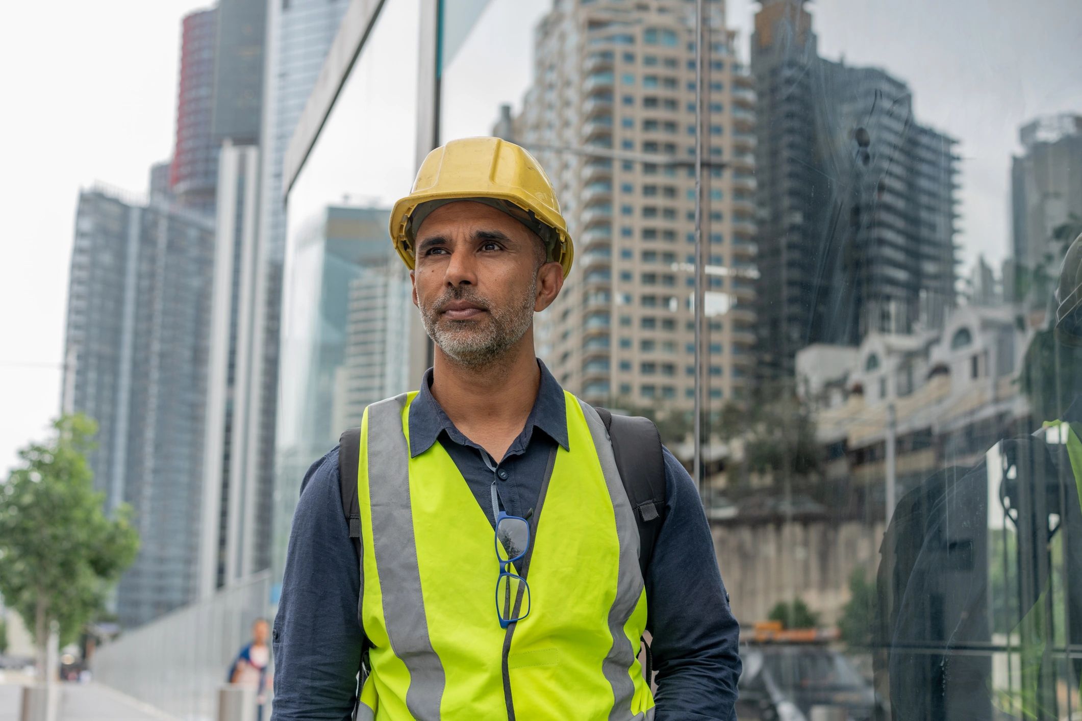 Portrait of a construction professional in high-visibility vest and hard hat